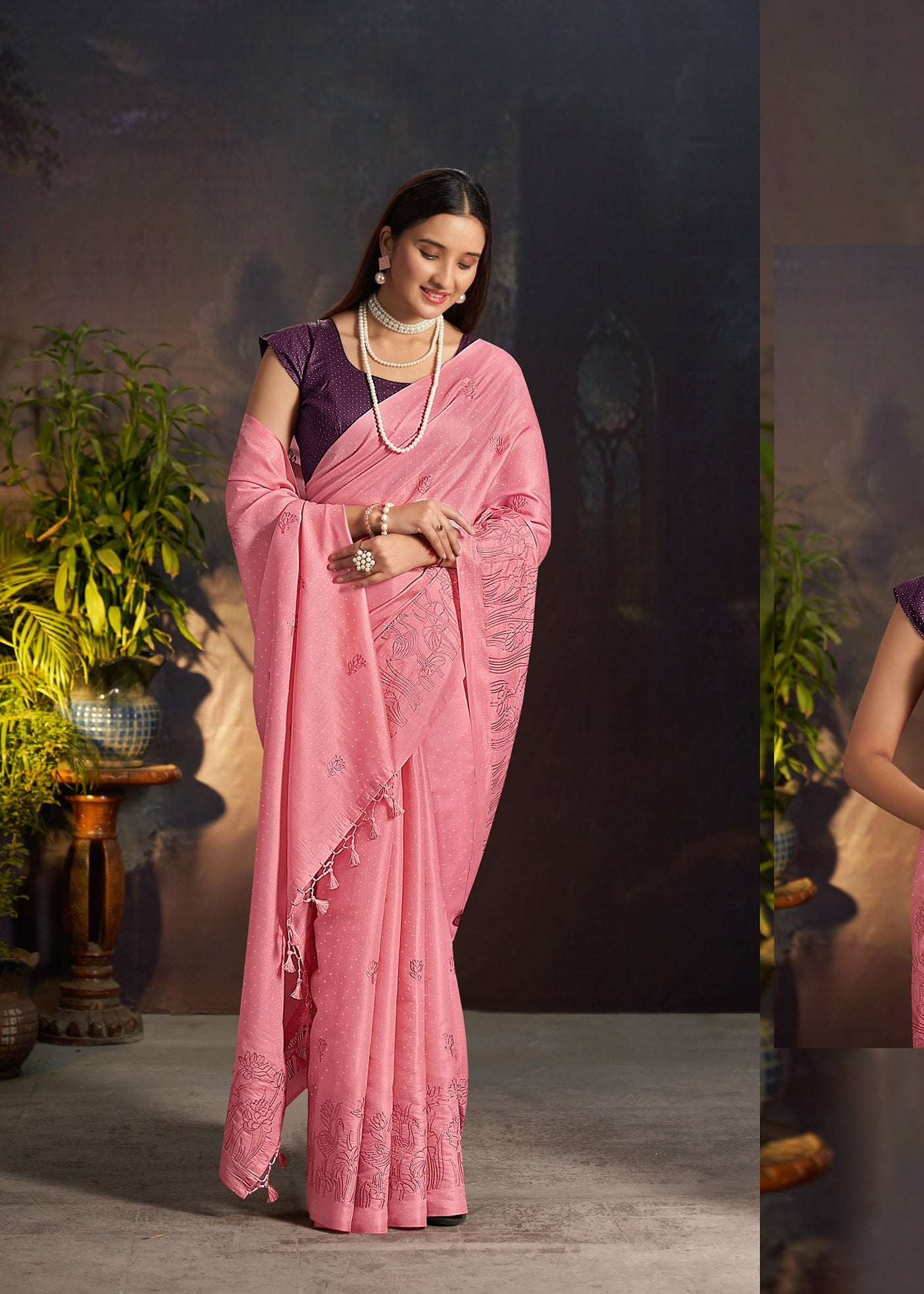 Pink silk saree with embroidered border and draped pallu