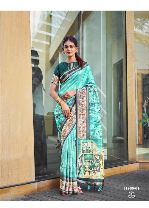Turquoise silk saree with zari border and Kalamkari mural print, draped pallu