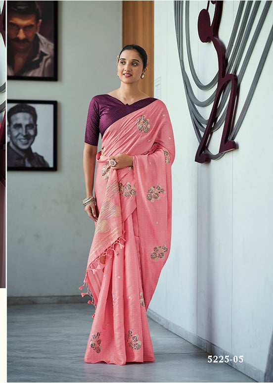 Pink embroidered saree with matching blouse, floral motifs and draped pleats