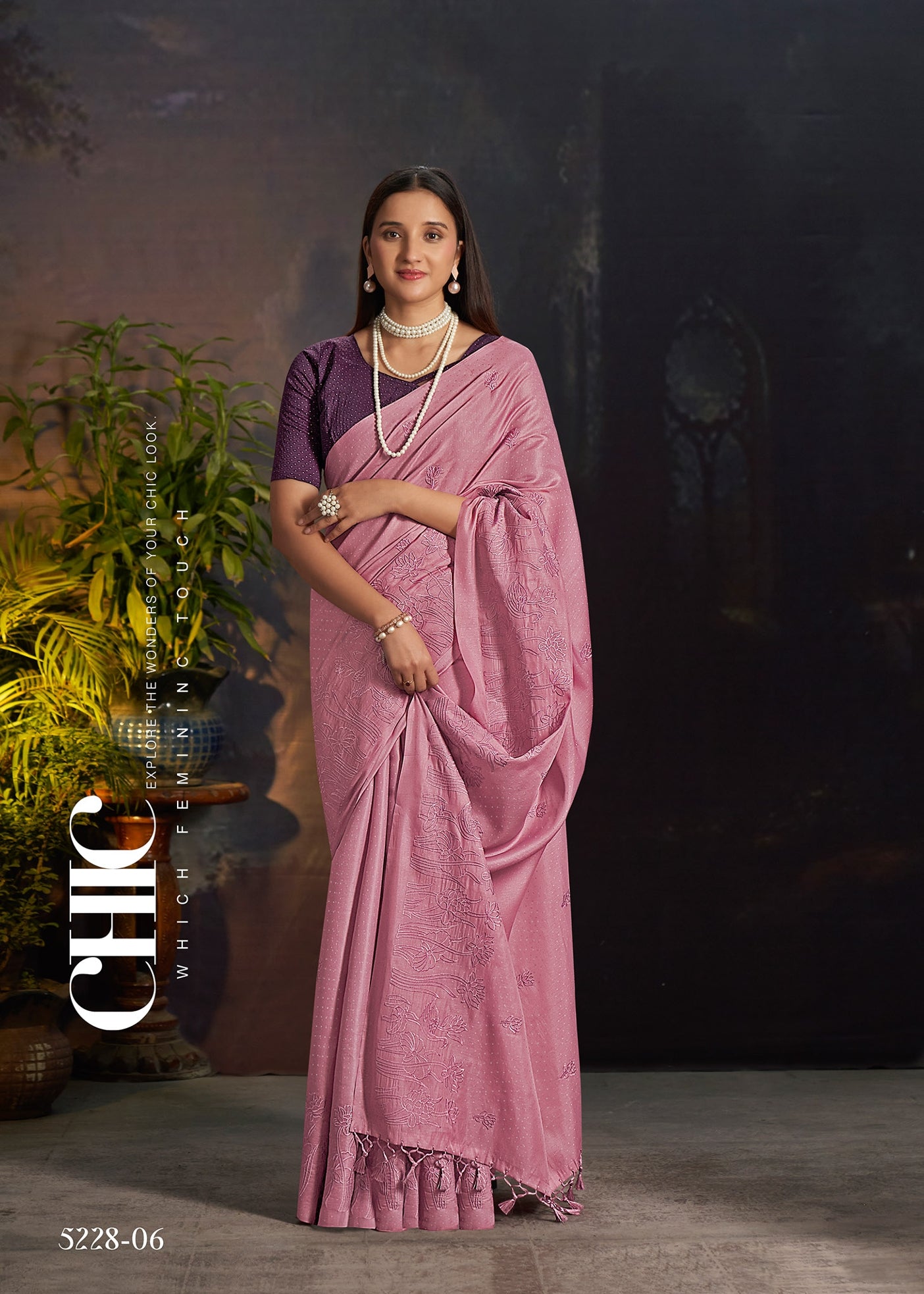 Mauve silk saree with embroidered motifs and pleated drape with patterned pallu