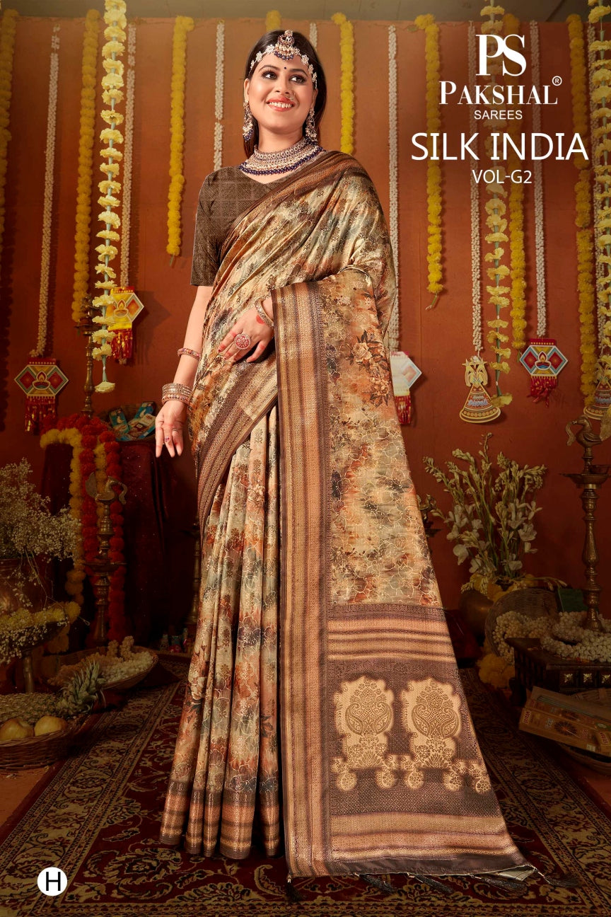 Bronze-gold silk saree with zari border and woven floral motifs, draped
