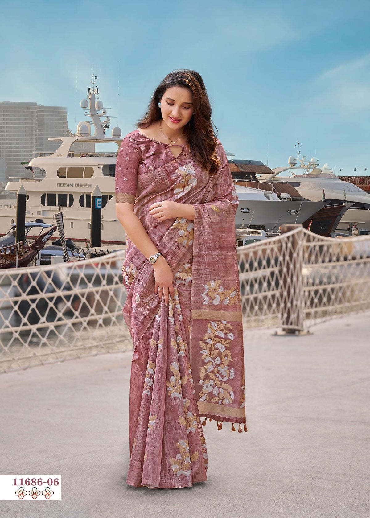 Rose pink cotton saree with gold floral border and draped pallu