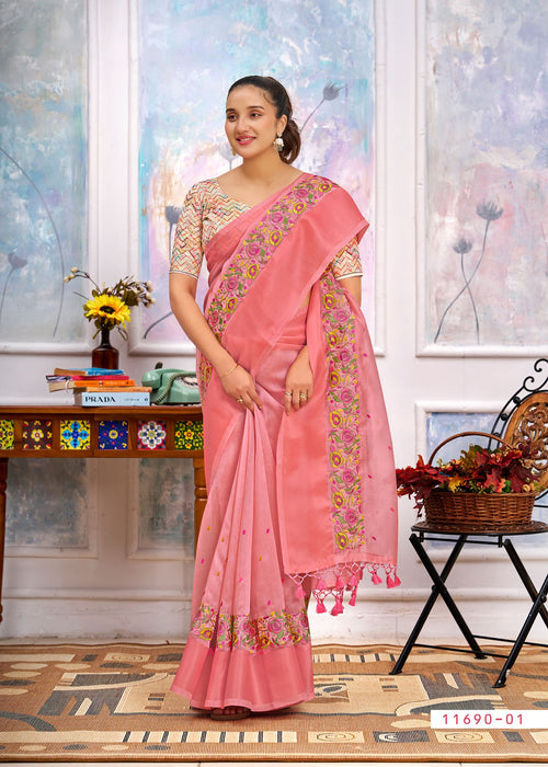 Pink cotton saree with floral border, embroidered pallu drape and tassel ends