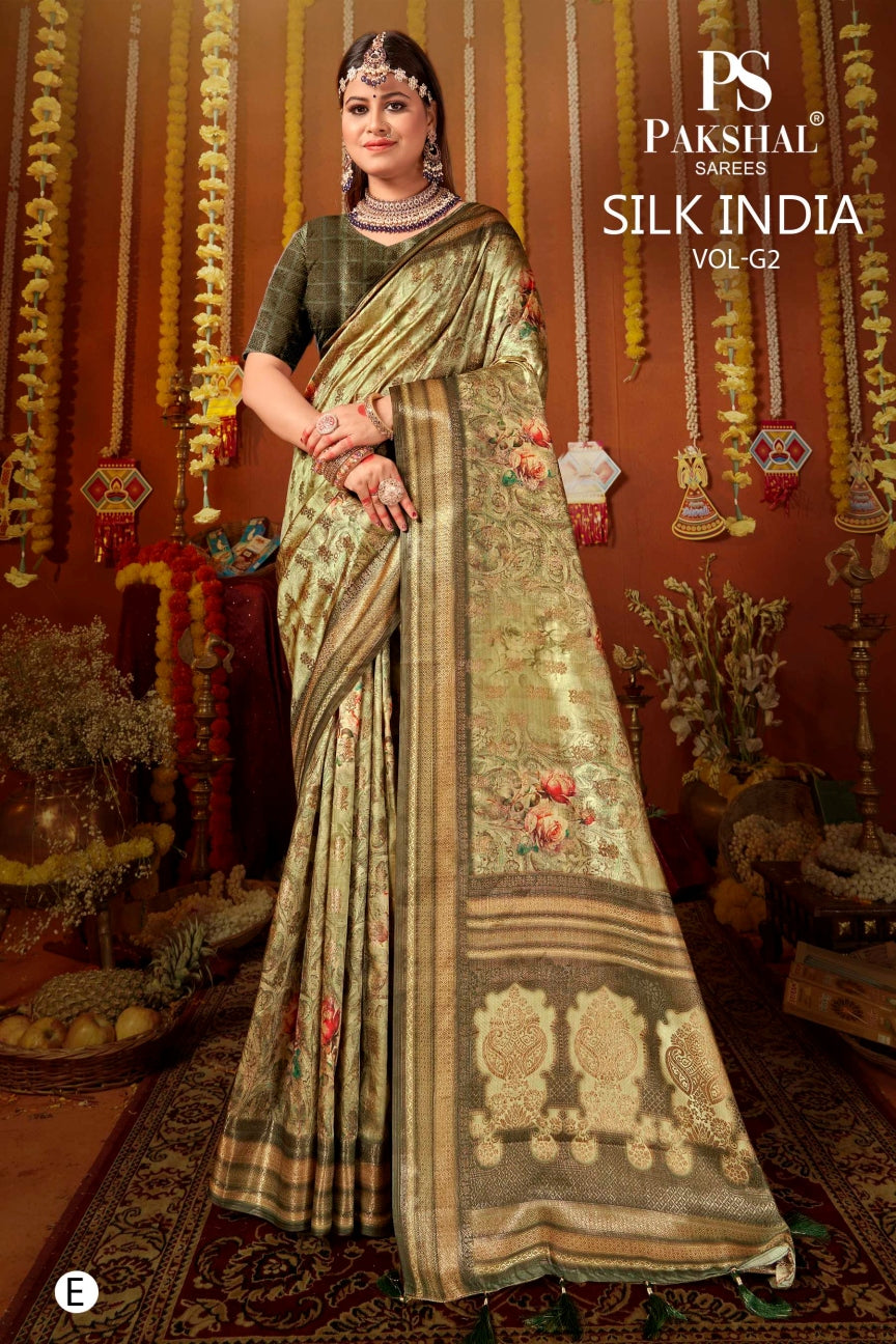 Olive silk saree with gold zari border and floral vine motifs, draped