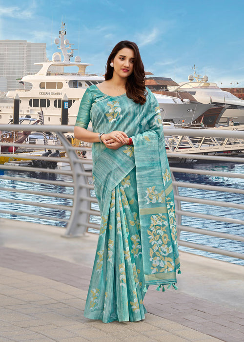 Teal blue cotton saree with gold motif border and draped pallu