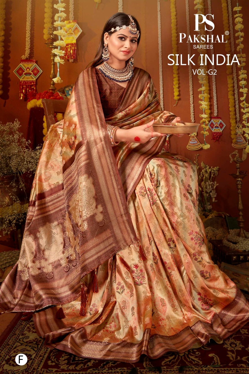 Copper-brown silk saree with gold motifs and zari border, pallu wrap