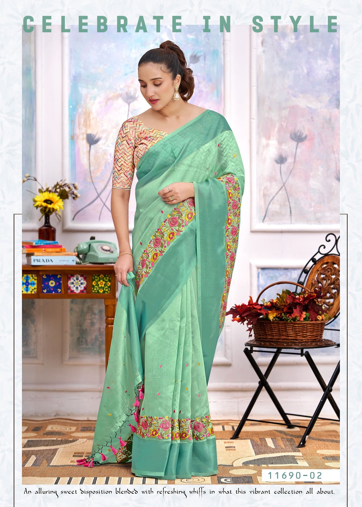 Mint green cotton saree with floral border, embroidered pallu drape and tassel ends
