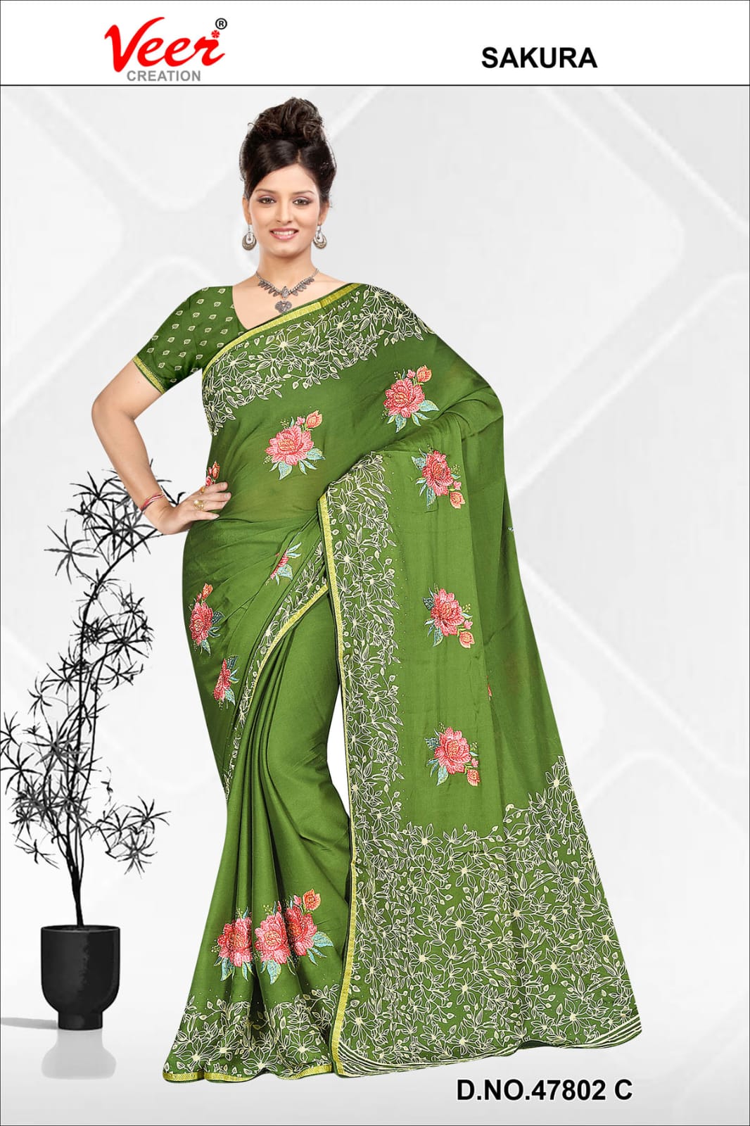 Green saree with pink floral embroidery and leaf border, draped with blouse sleeves