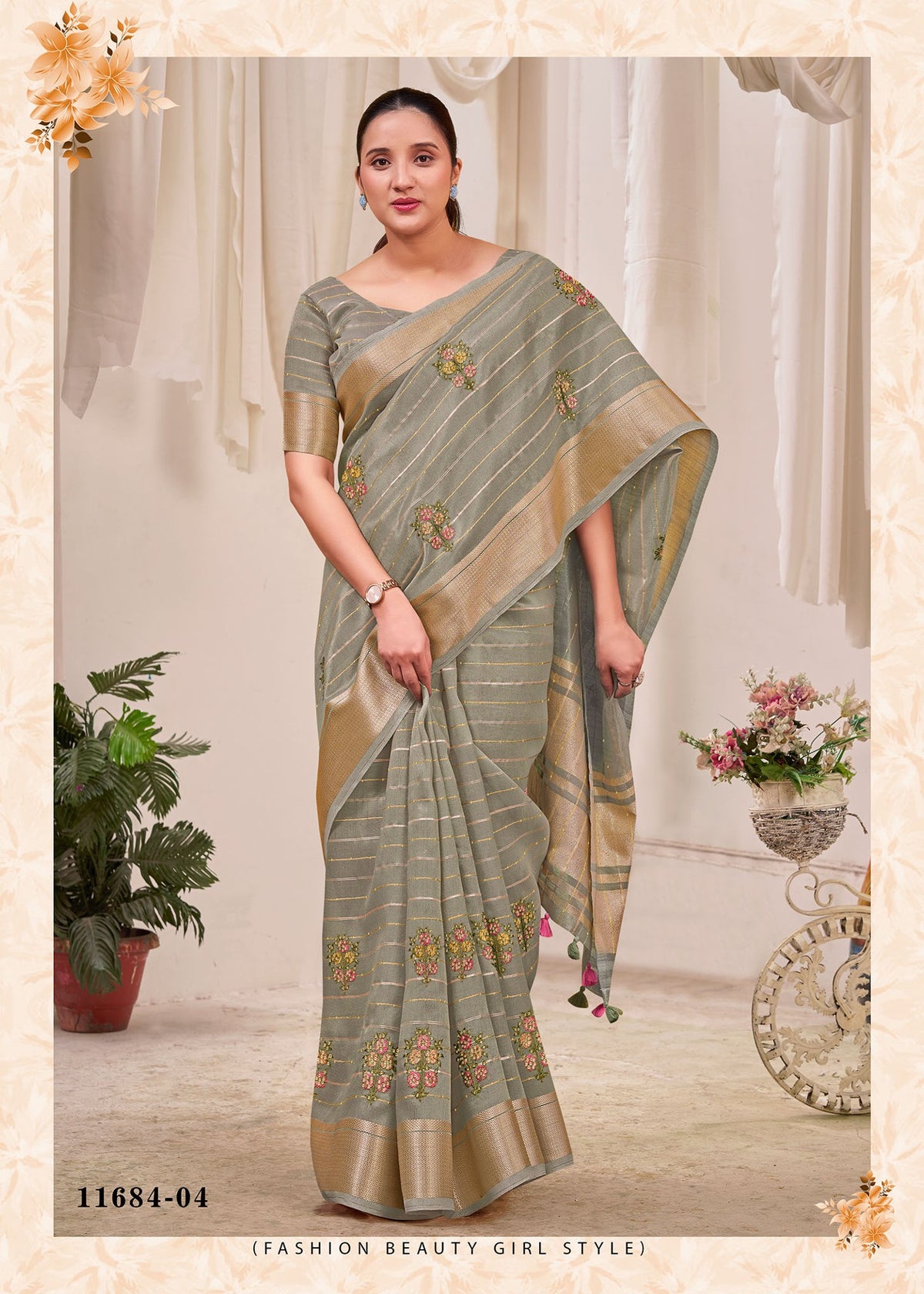 Grey cotton saree with green floral print, striped border, and matching pallu