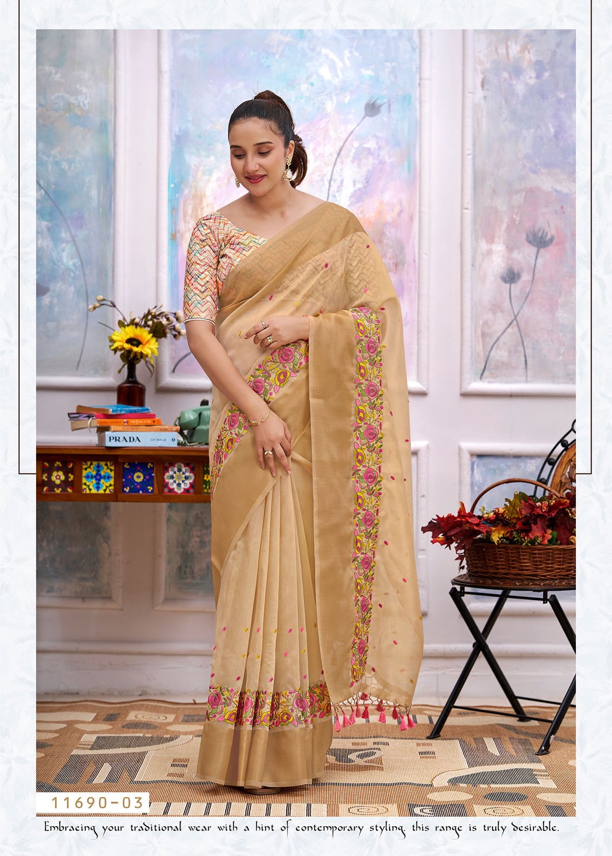 Beige cotton saree with floral border, embroidered pallu drape and tassel ends