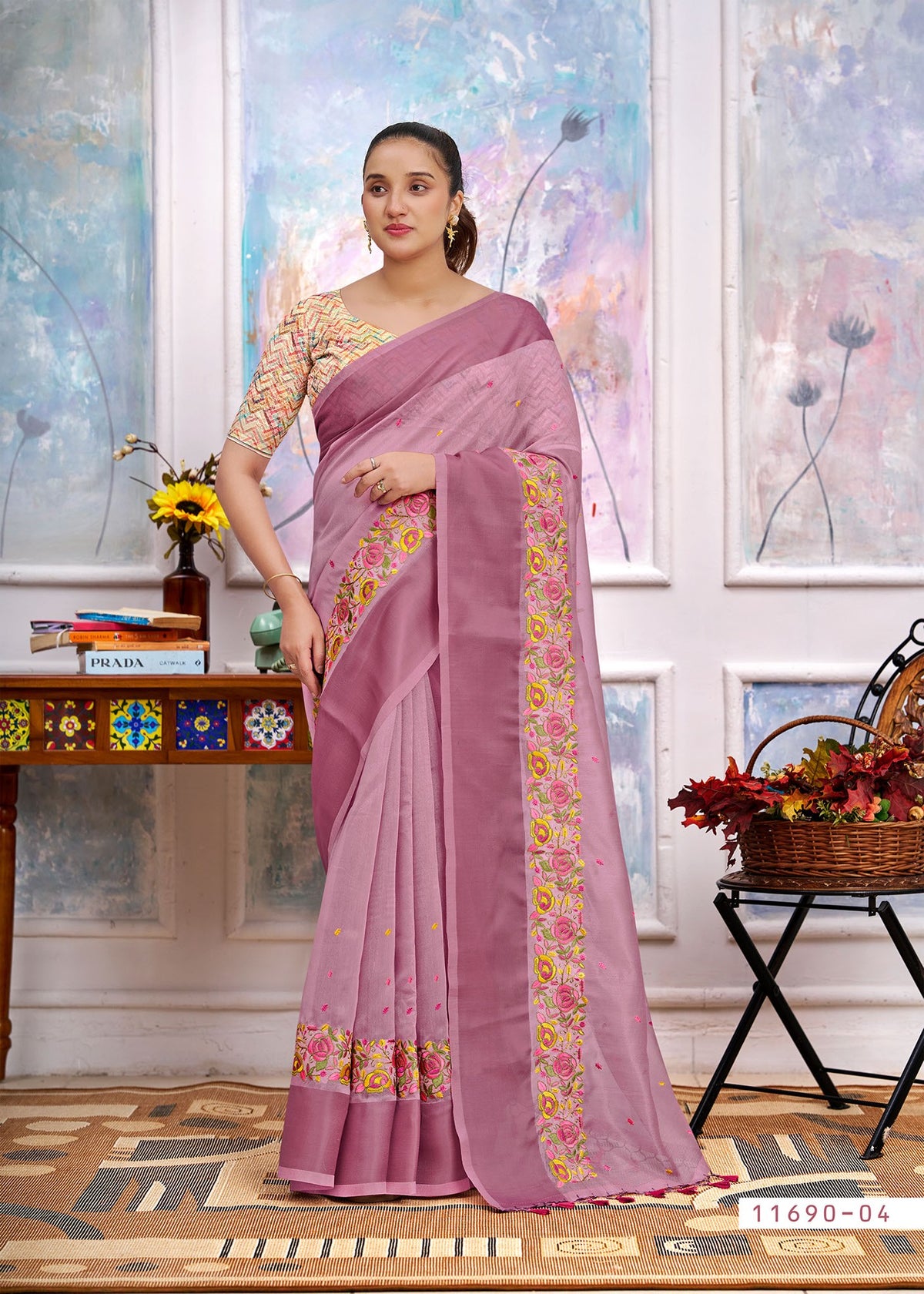 Mauve cotton saree with floral border, embroidered pallu drape and tassel ends
