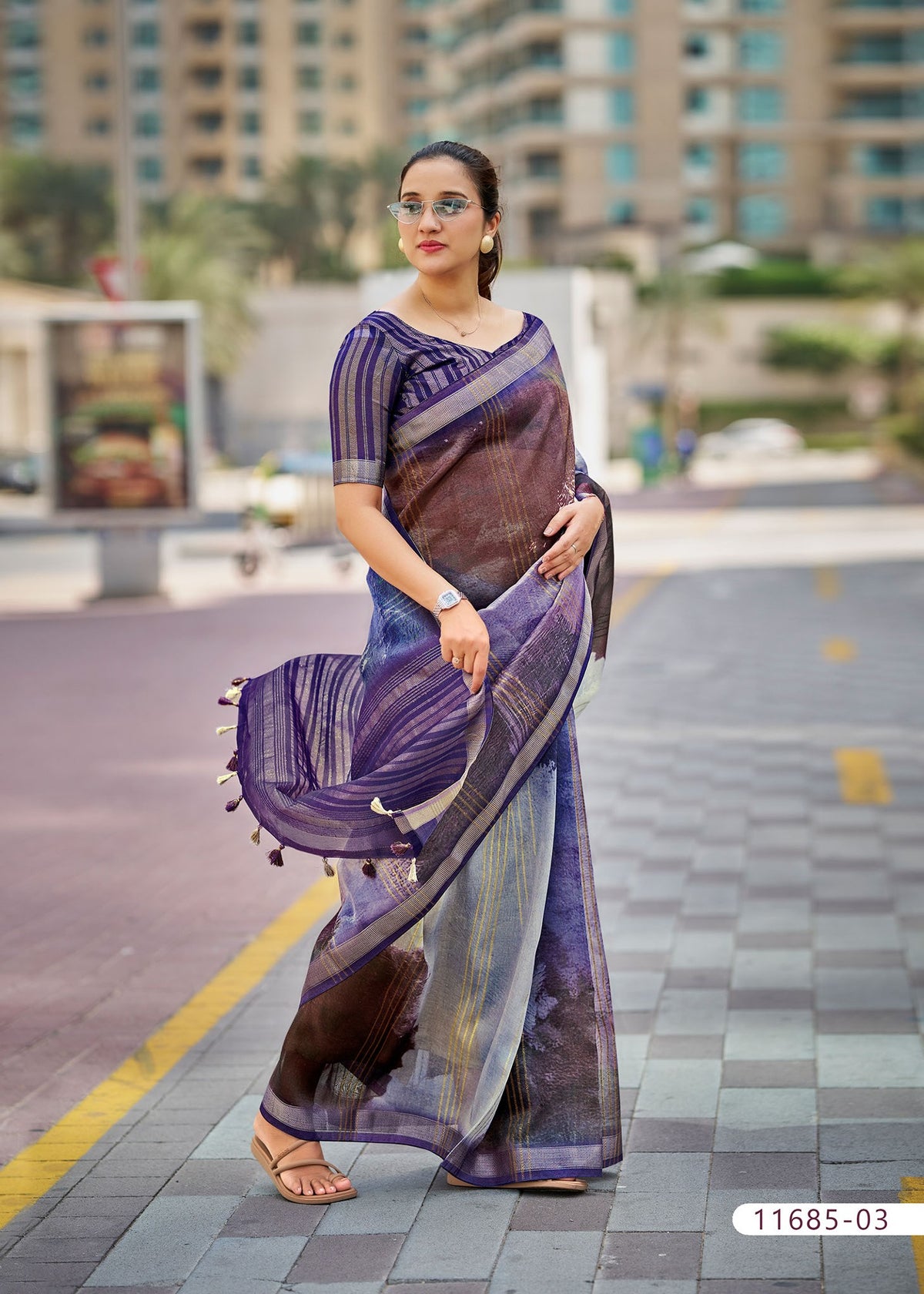 Cotton fancy saree in deep purple with striped pallu and woven border.