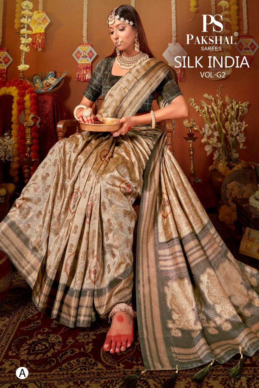 Gold-cream silk saree with zari border and floral motifs, draped pallu