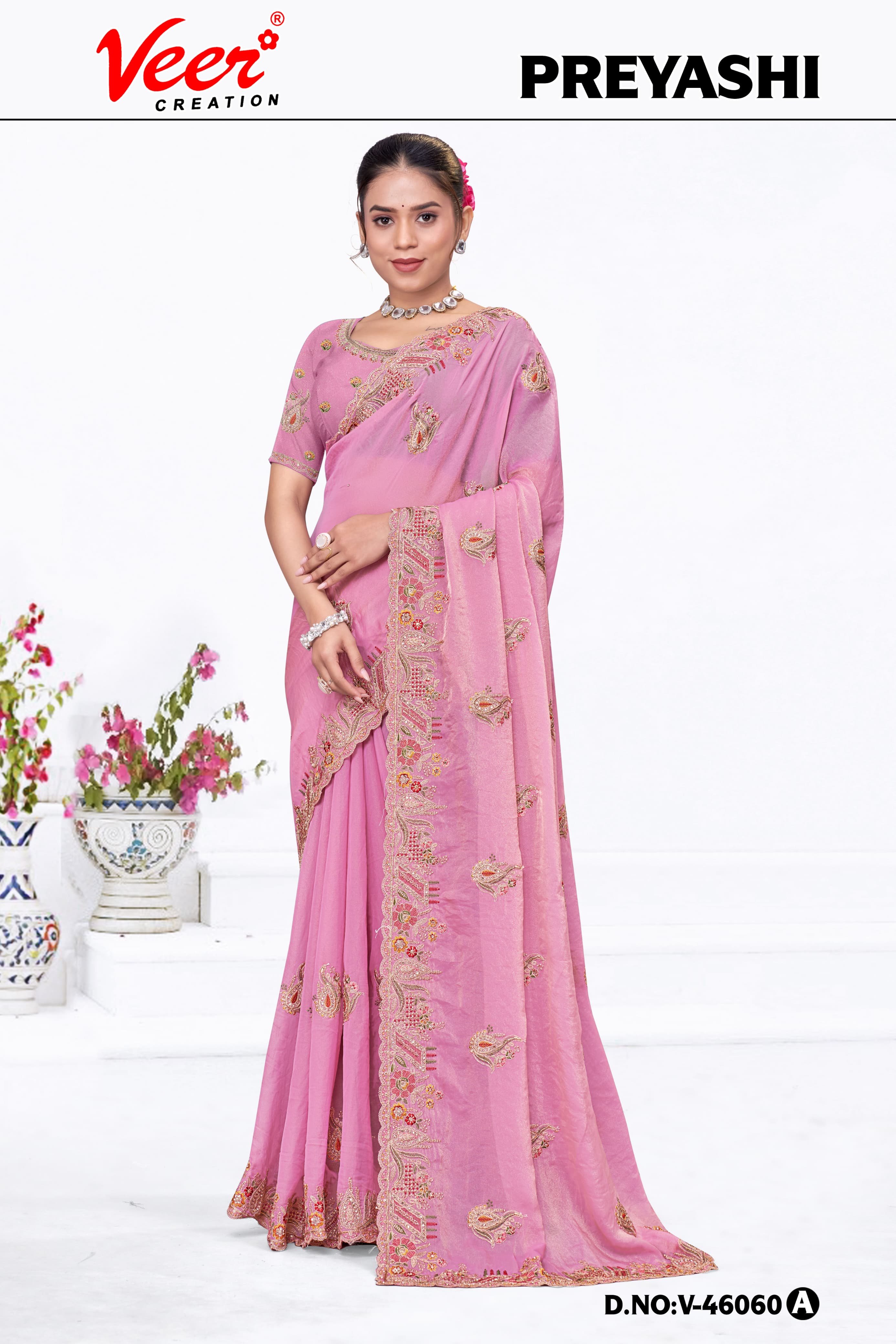 Pink embroidered saree with scalloped border and gold-toned floral work