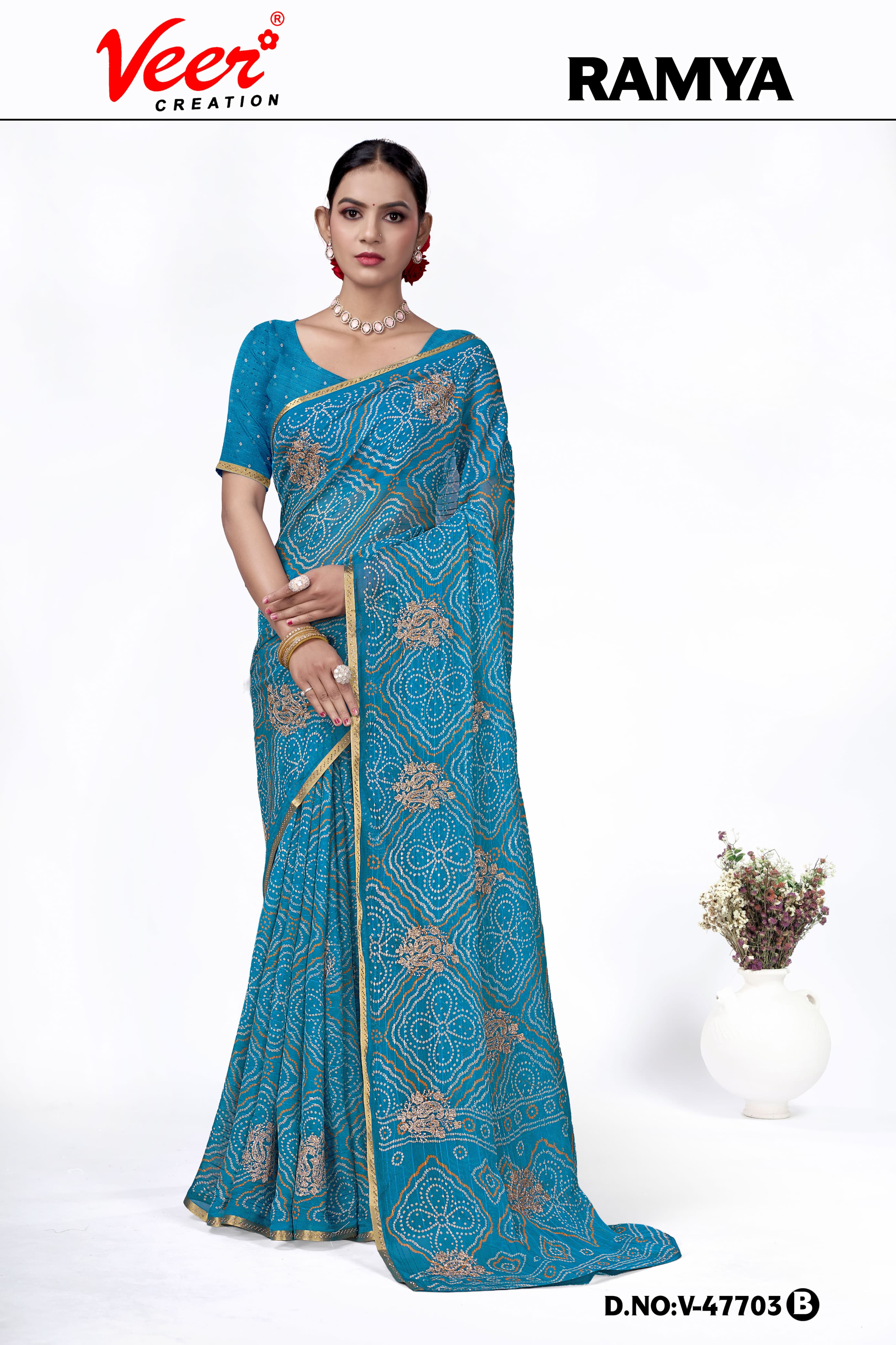 Blue bandhani print saree with gold booti embroidery and ornate border