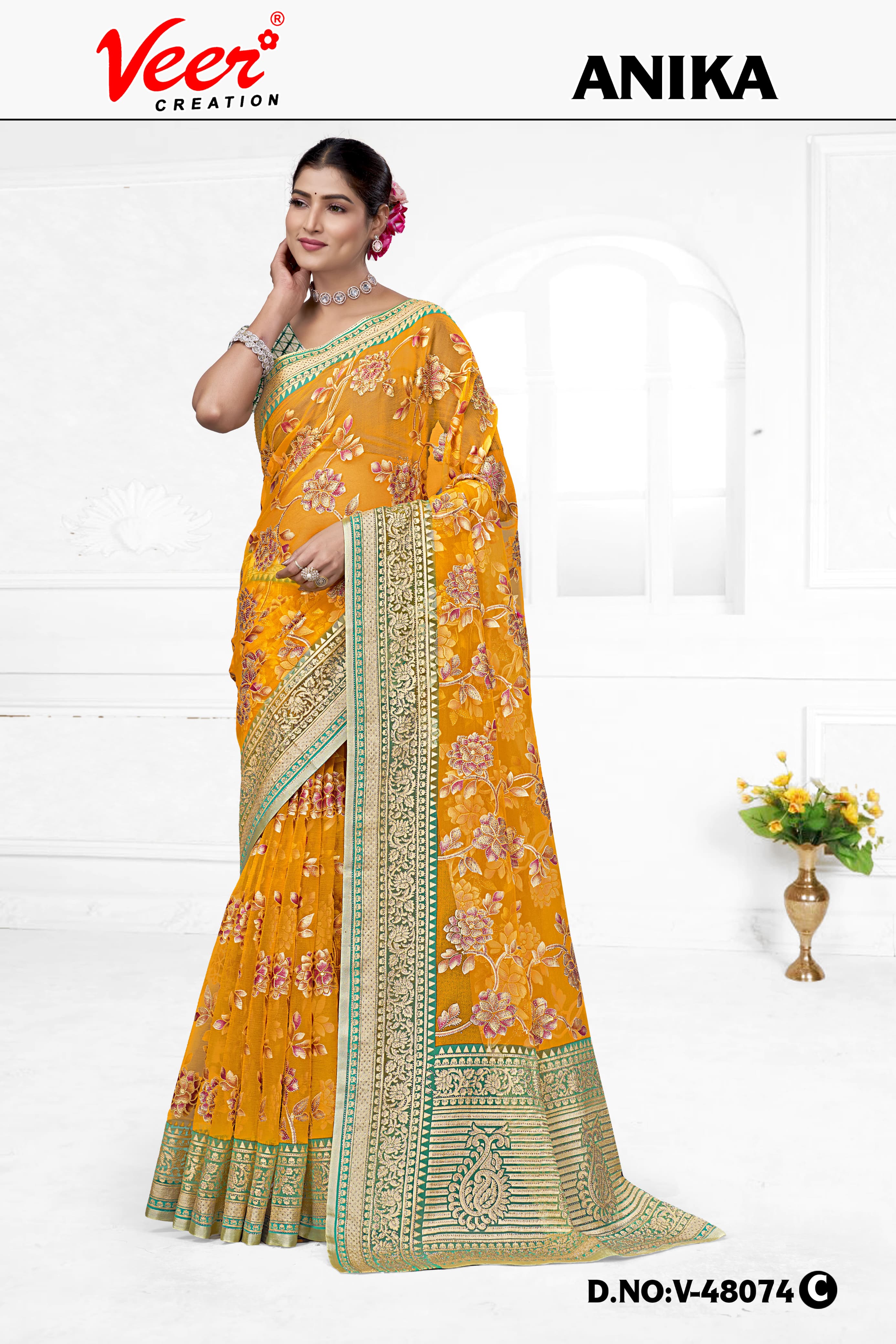 Orange floral net saree with zari border and patterned pallu