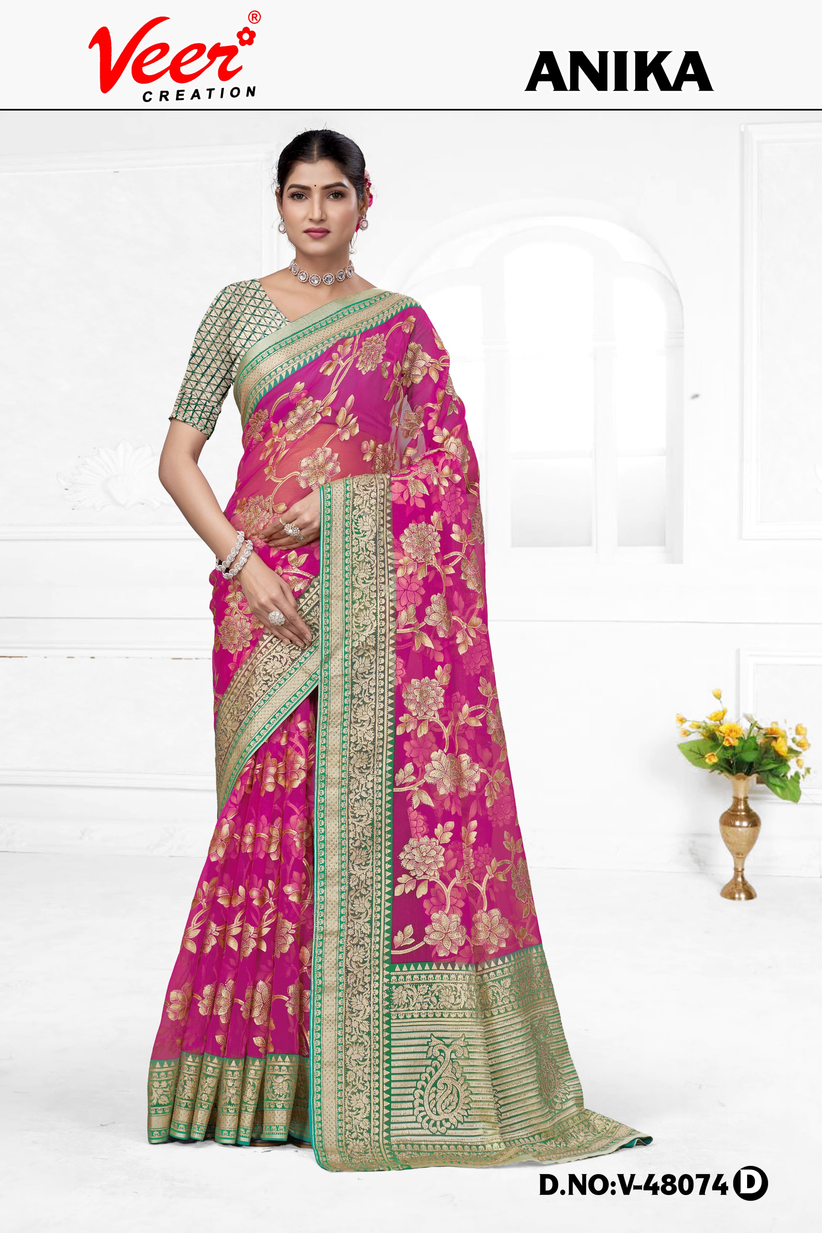 Pink floral net saree with zari border and patterned pallu