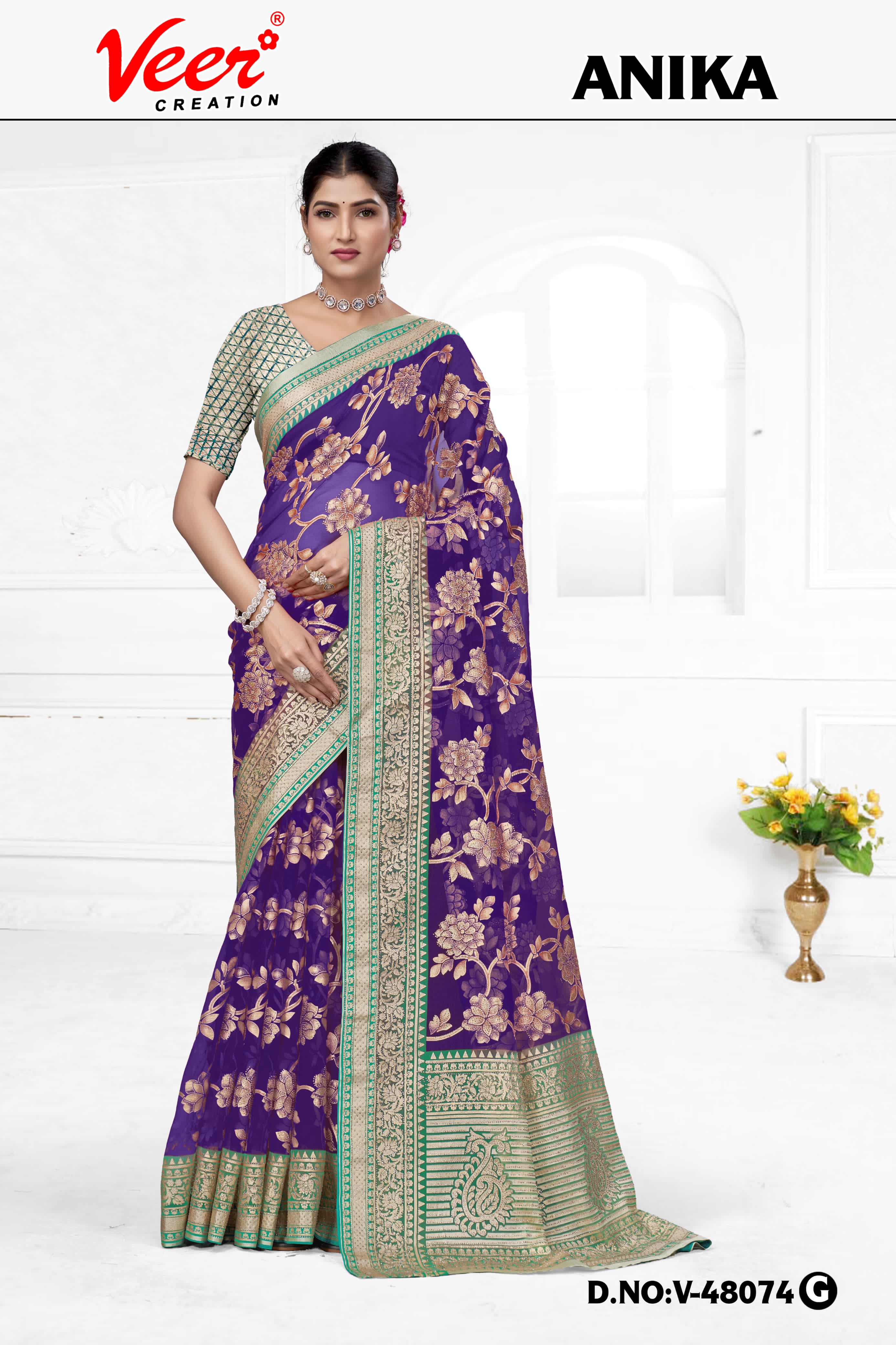 Dark purple floral net saree with zari border and patterned pallu