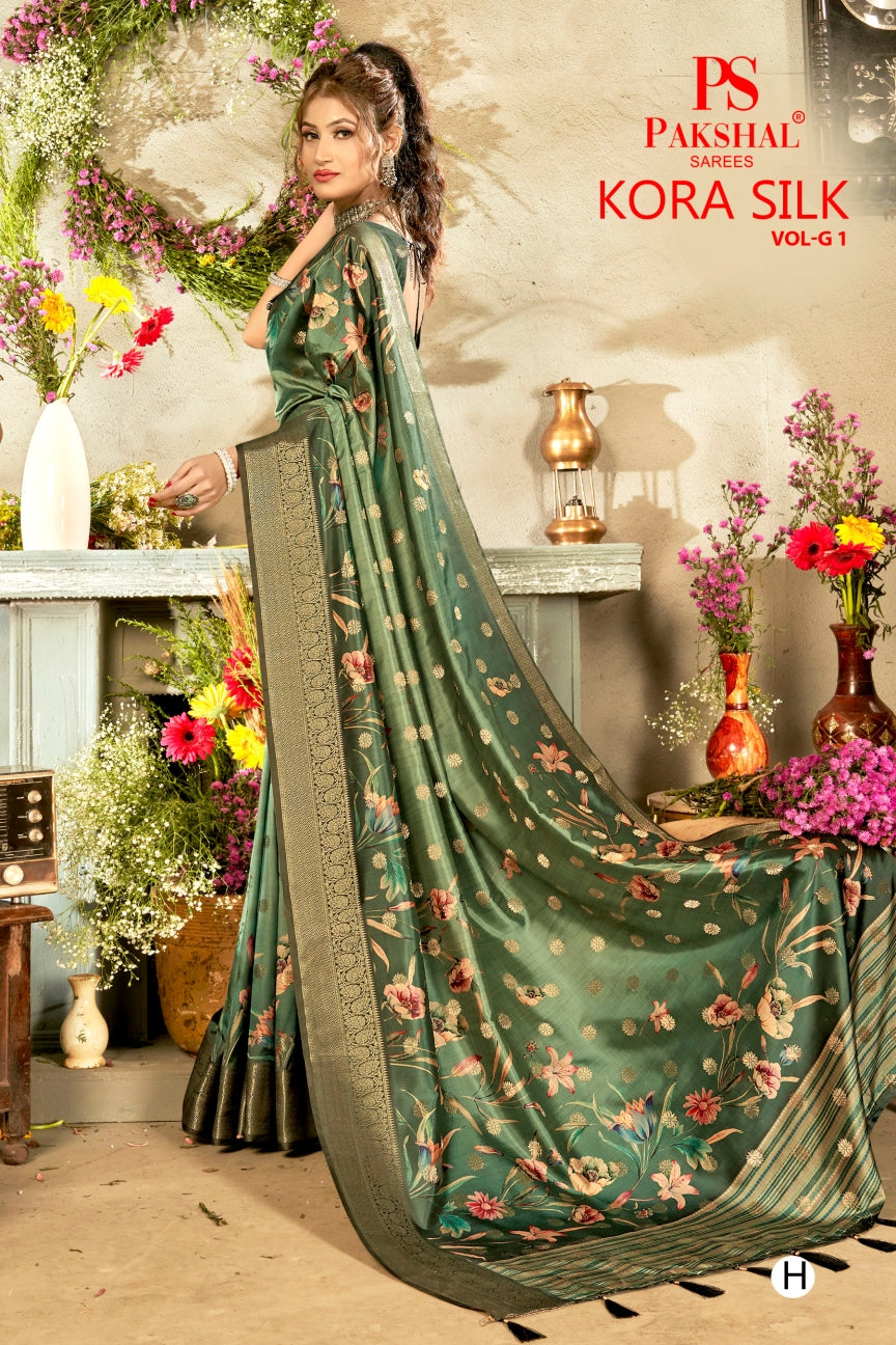 Deep green floral silk saree with woven gold border and long pallu