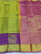 Olive silk body and purple pallu with gold zari motifs and patterned border