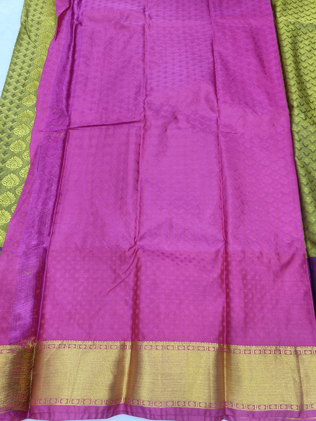 Purple pleated section of Kanchipuram silk saree with gold zari trim at hem
