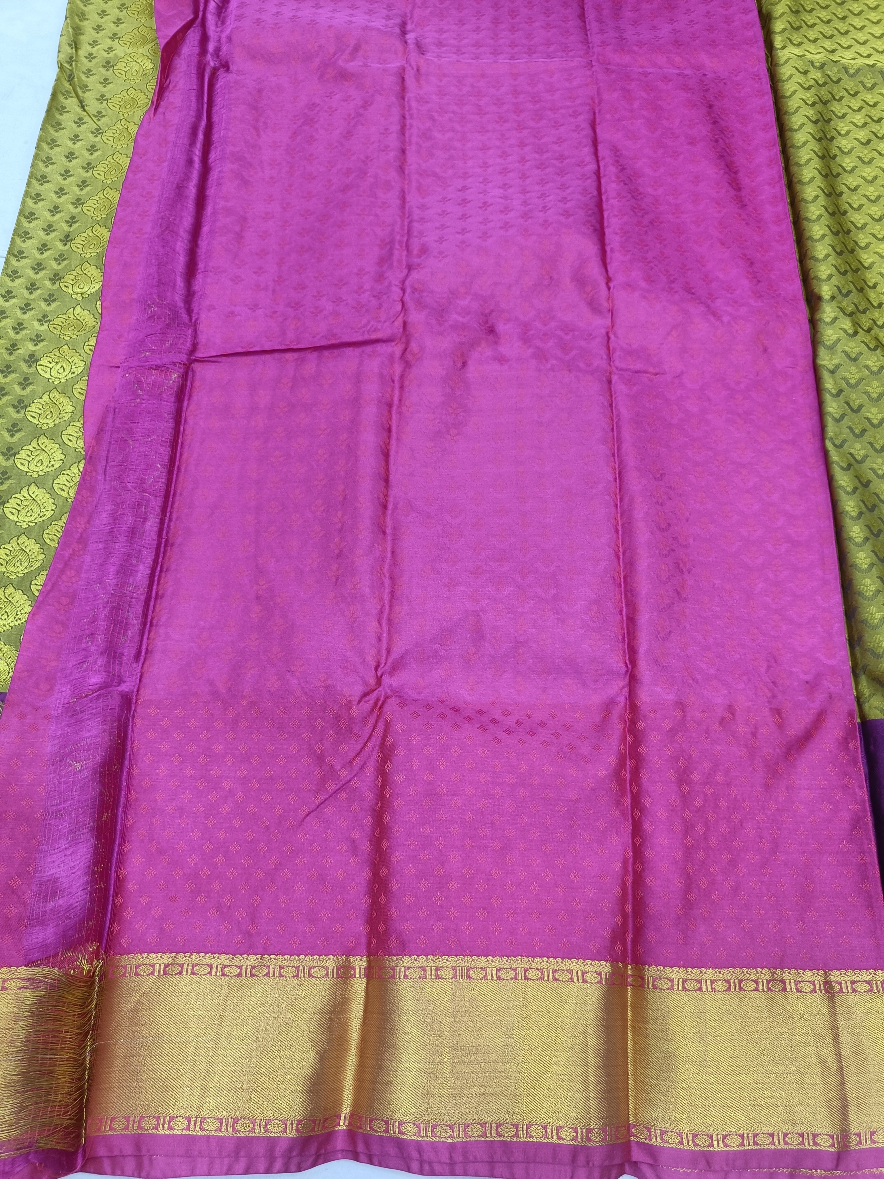 Purple pleated section of Kanchipuram silk saree with gold zari trim at hem