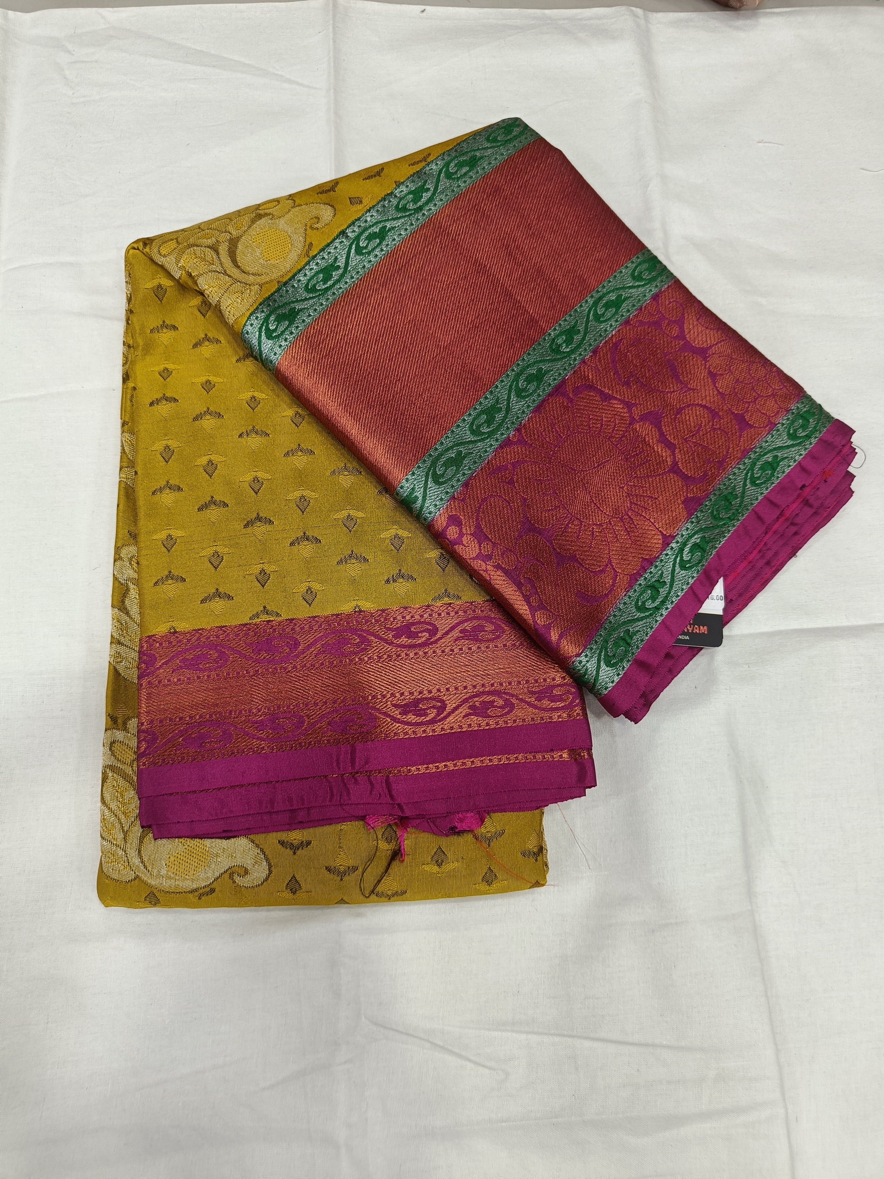 Yellow and pink Kanchipuram silk saree with green border, unstitched blouse piece