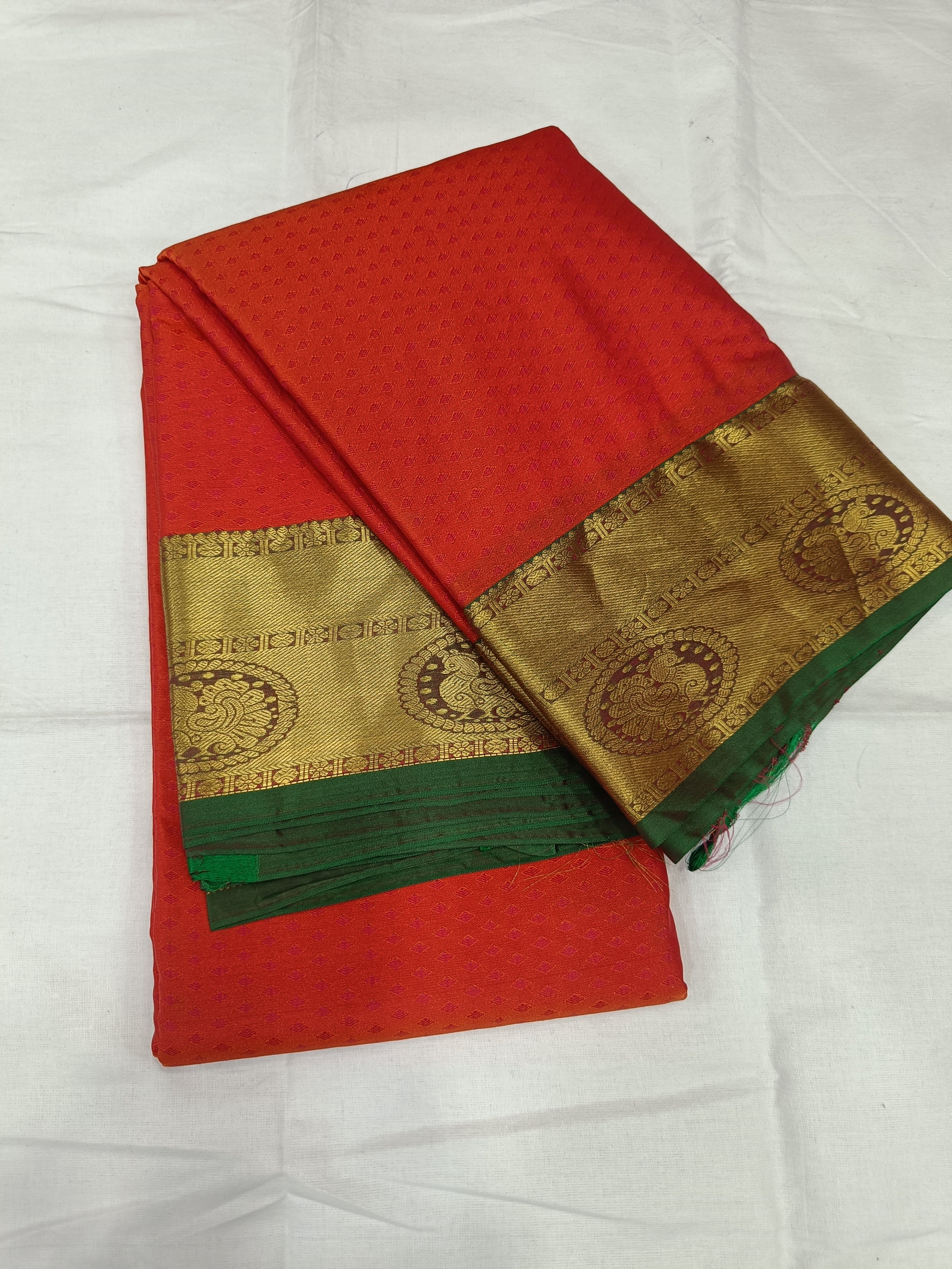 Red and olive-green silk saree with gold border and woven motifs