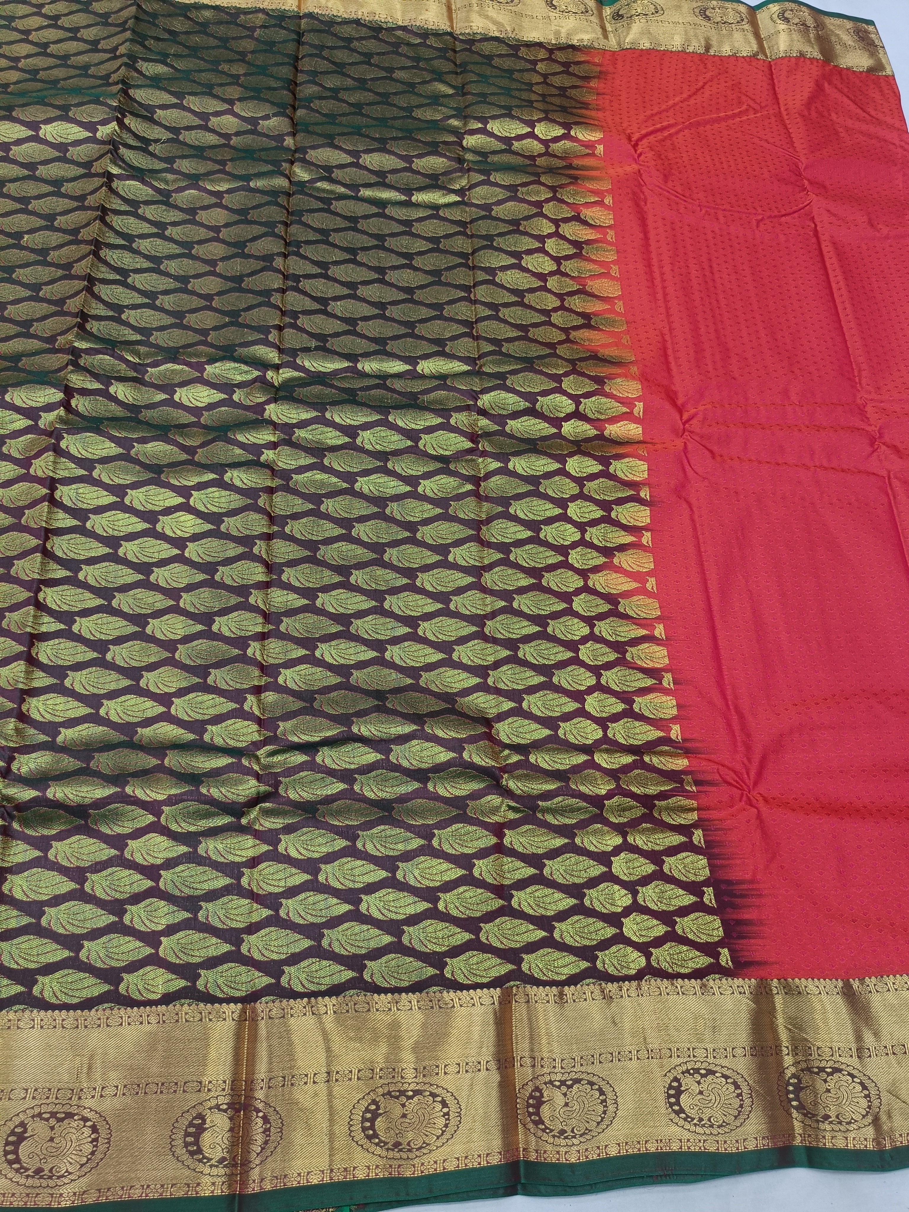 Red saree with olive-green patterned body and wide gold border
