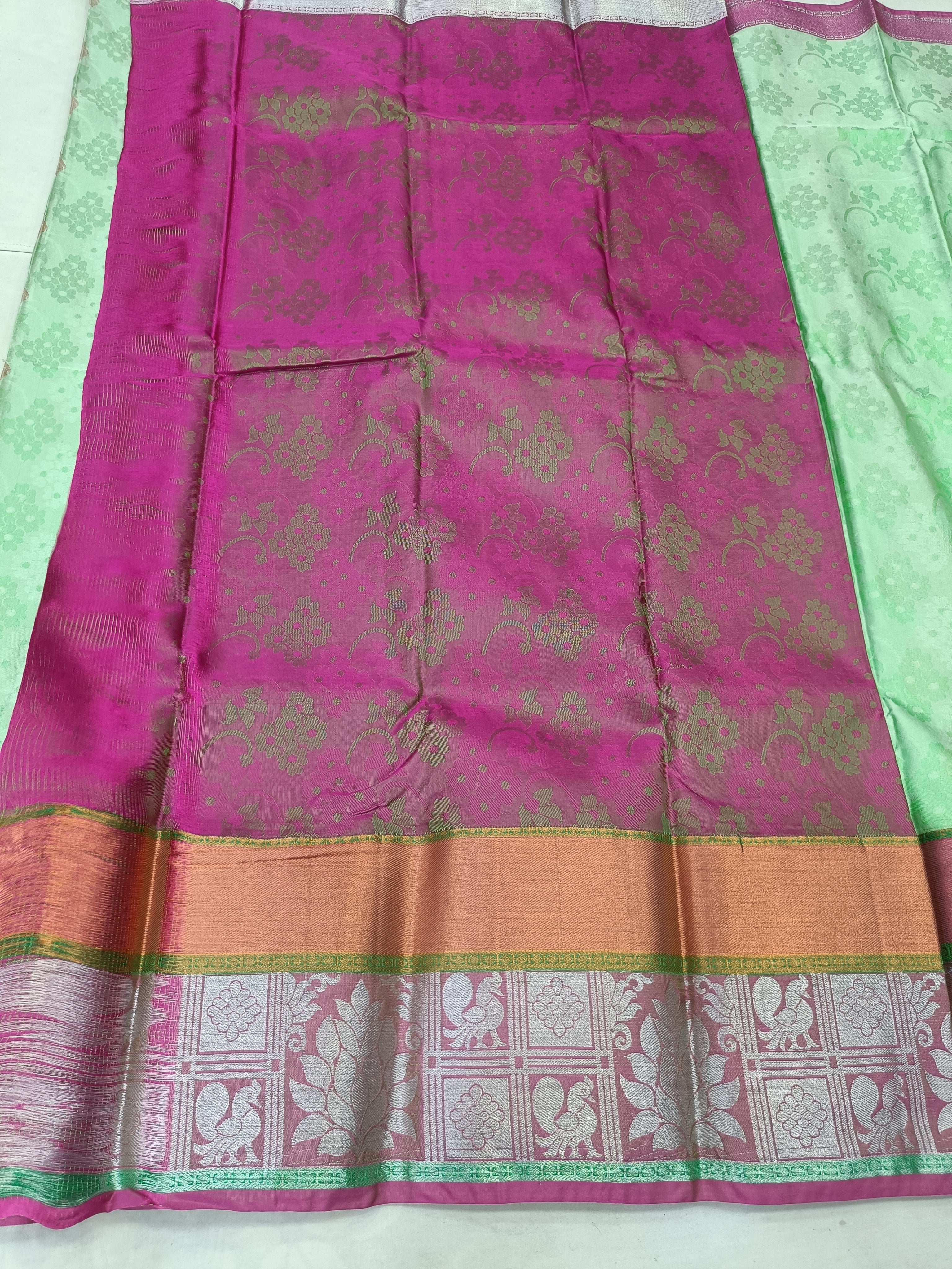 Kanchipuram silk saree in mint green and pink with gold-pattern border