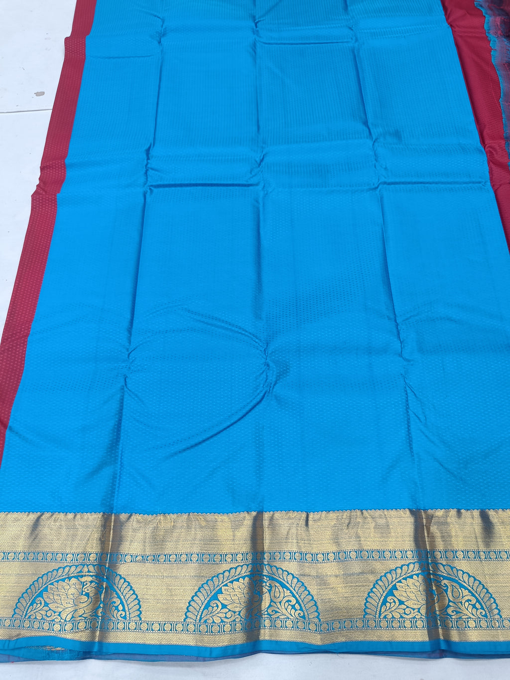 Blue silk saree fabric panel with red edge, gold border and patterned trim