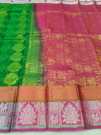Green and pink Kanchipuram silk saree with gold woven motifs and pallu border