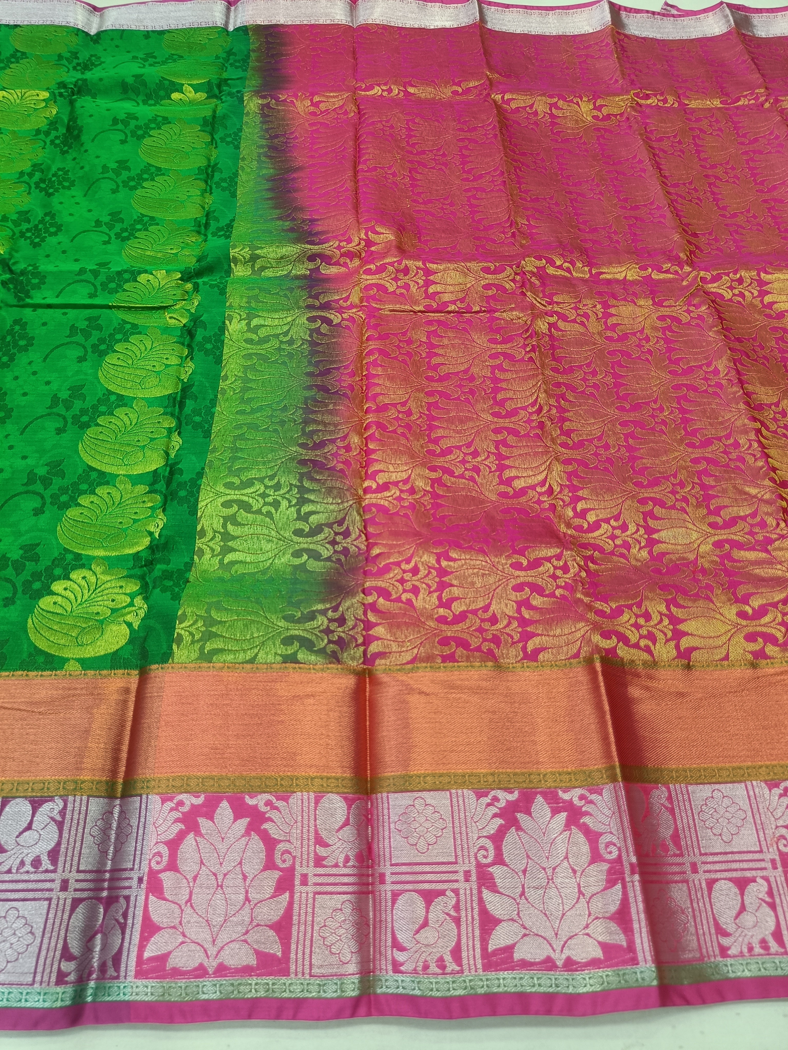 Green and pink Kanchipuram silk saree with gold woven motifs and pallu border