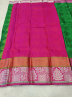 Green and pink silk saree panel with gold border stripe and woven motif hem