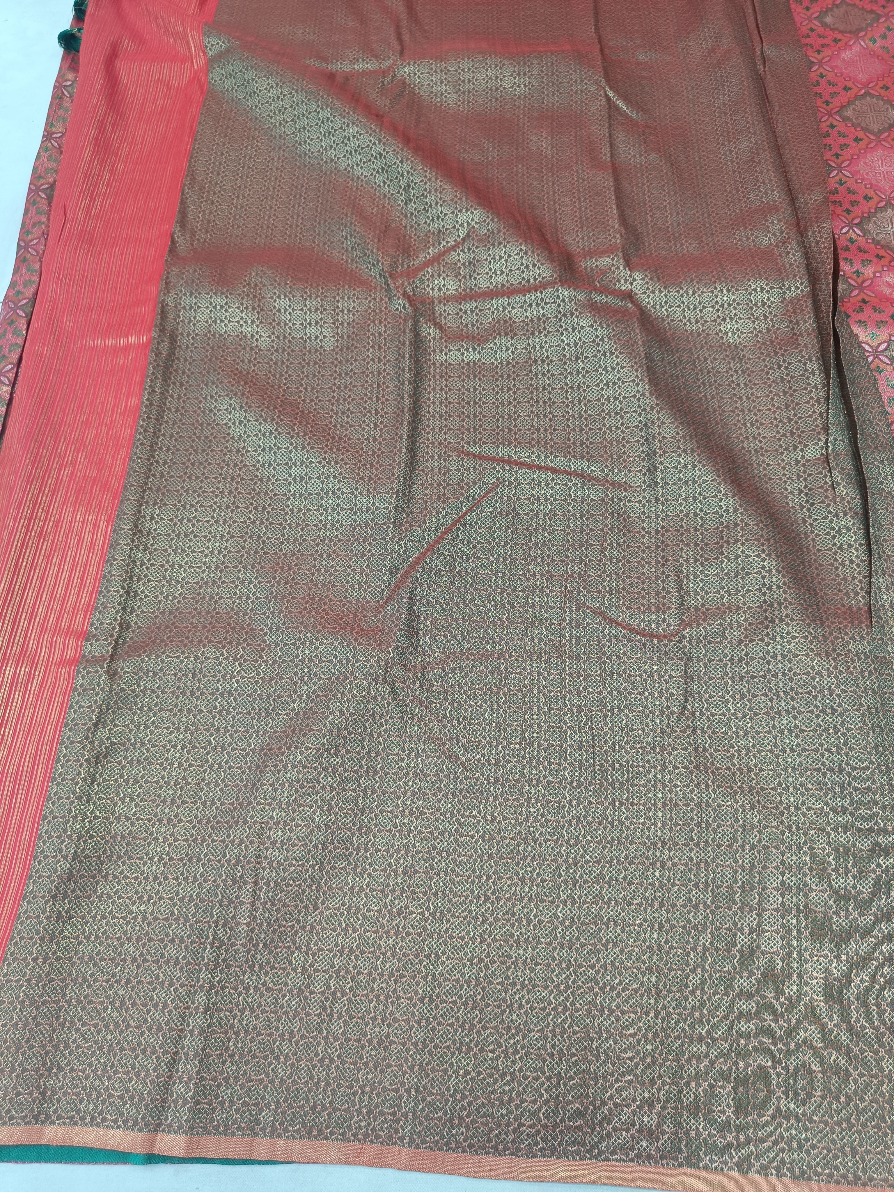 Pink and grey-beige saree body with fine weave texture and green-trim edge