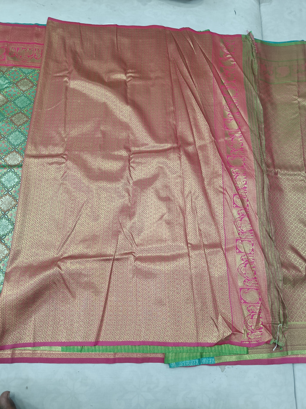 Green and pink Banarasi silk saree, magenta border with gold woven motifs