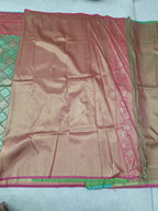 Green and pink Banarasi silk saree, magenta border with gold woven motifs