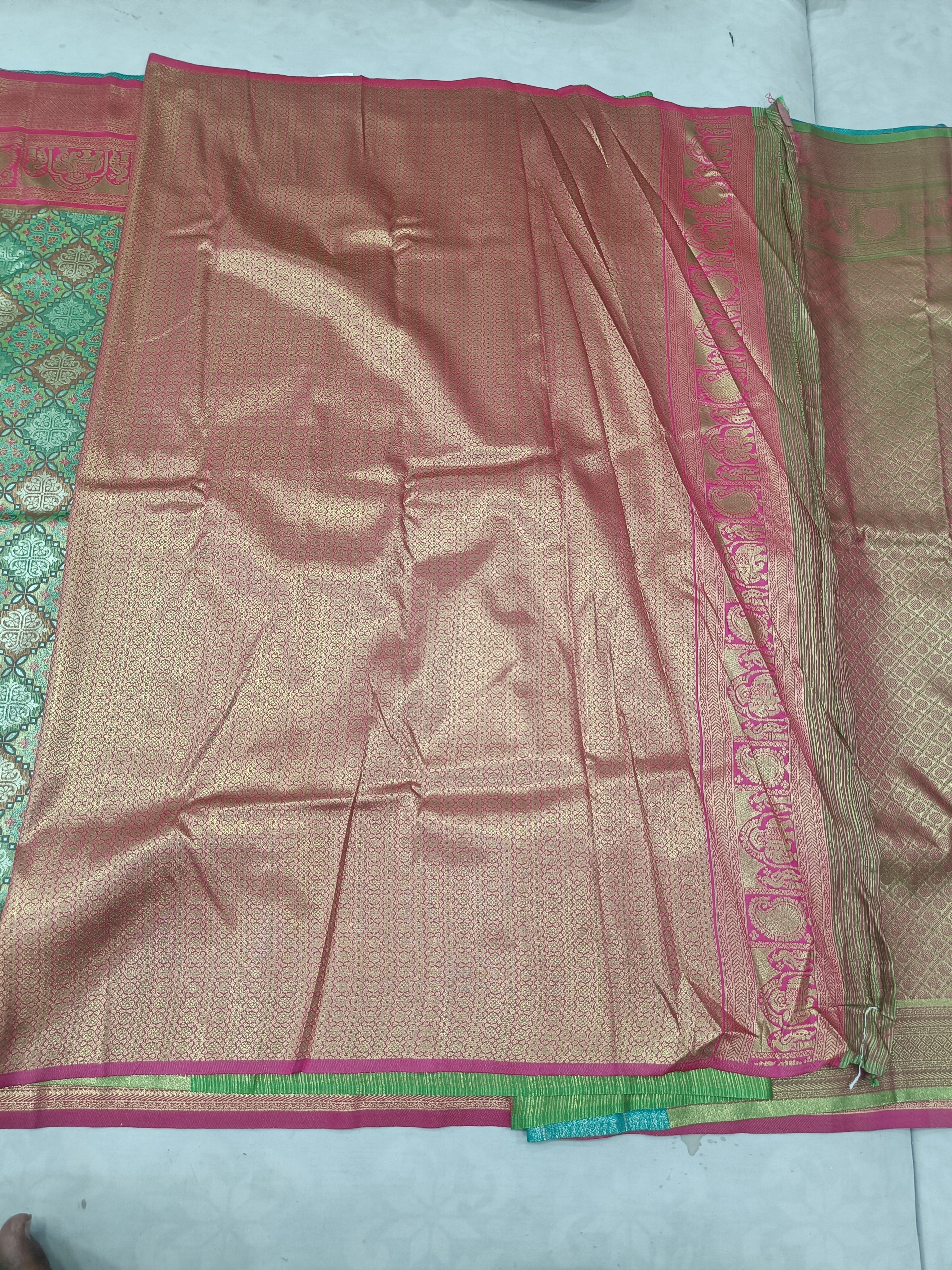 Green and pink Banarasi silk saree, magenta border with gold woven motifs