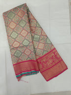 Multicolor silk saree with teal and gold motifs, wide magenta border and unstitched blouse fabric