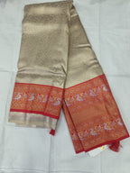 Silver and red Banarasi silk saree with matching unstitched blouse panel and red border