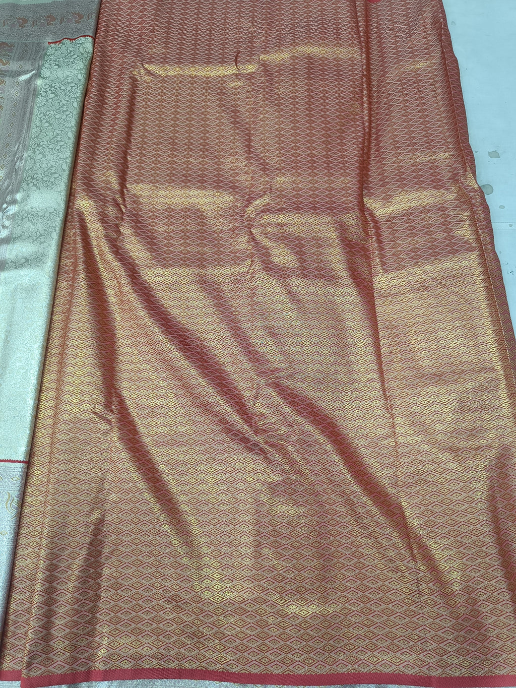 Silver and golden Banarasi silk saree with textured pattern and woven border