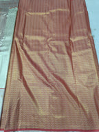 Silver and golden Banarasi silk saree with textured pattern and woven border