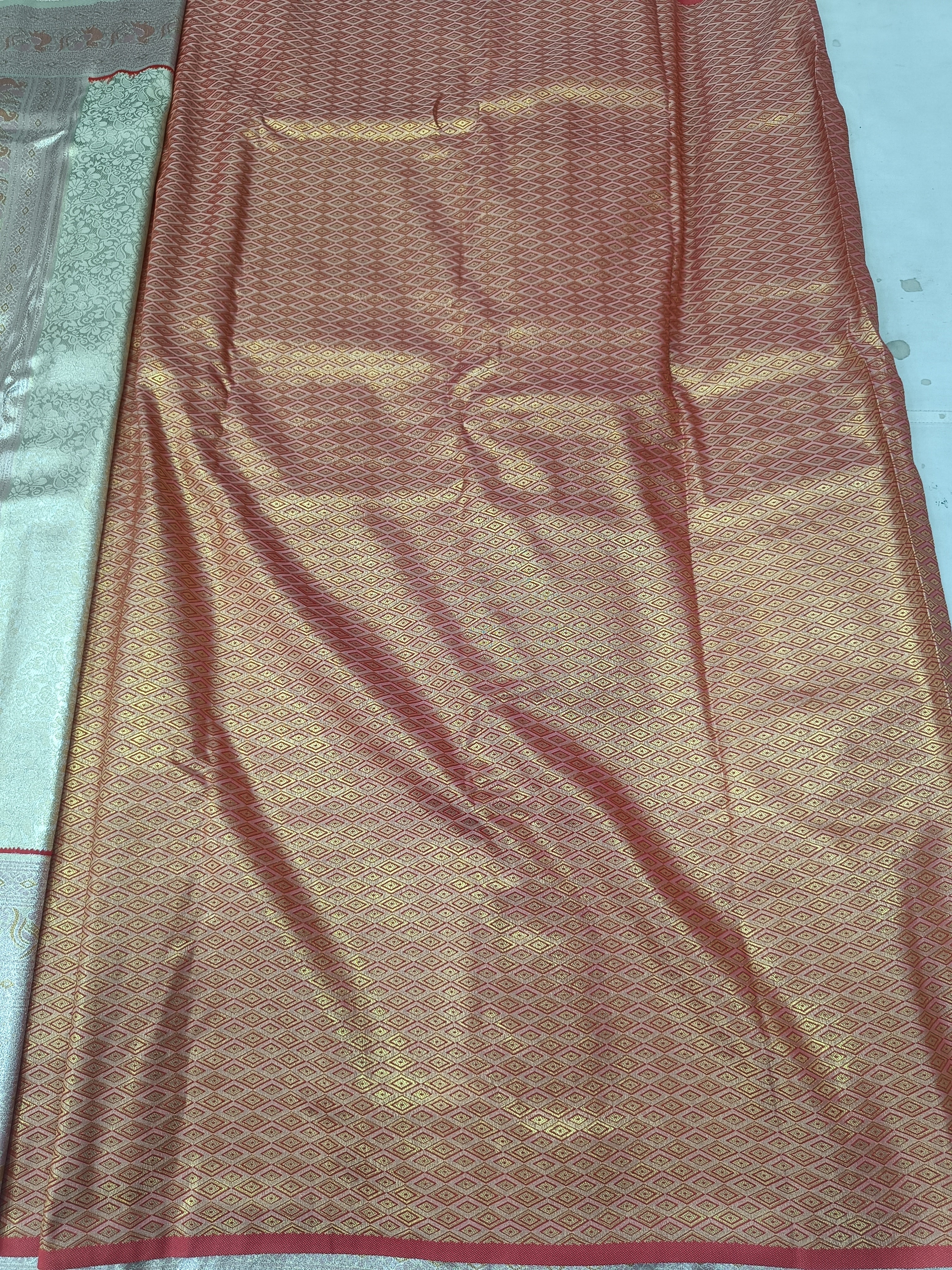 Silver and golden Banarasi silk saree with textured pattern and woven border