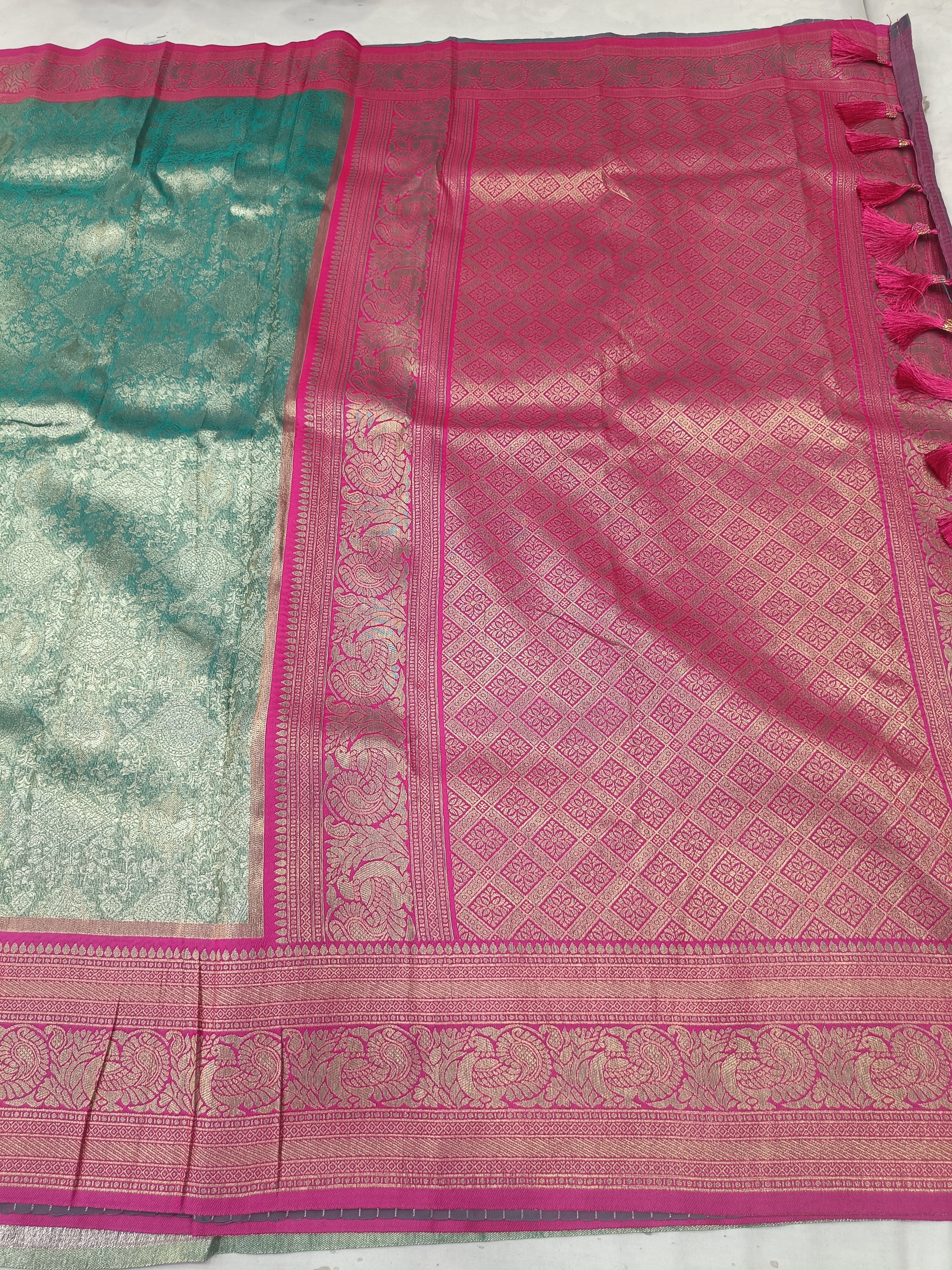 Banarasi silk saree pallu in teal green and magenta pink with woven motifs and border