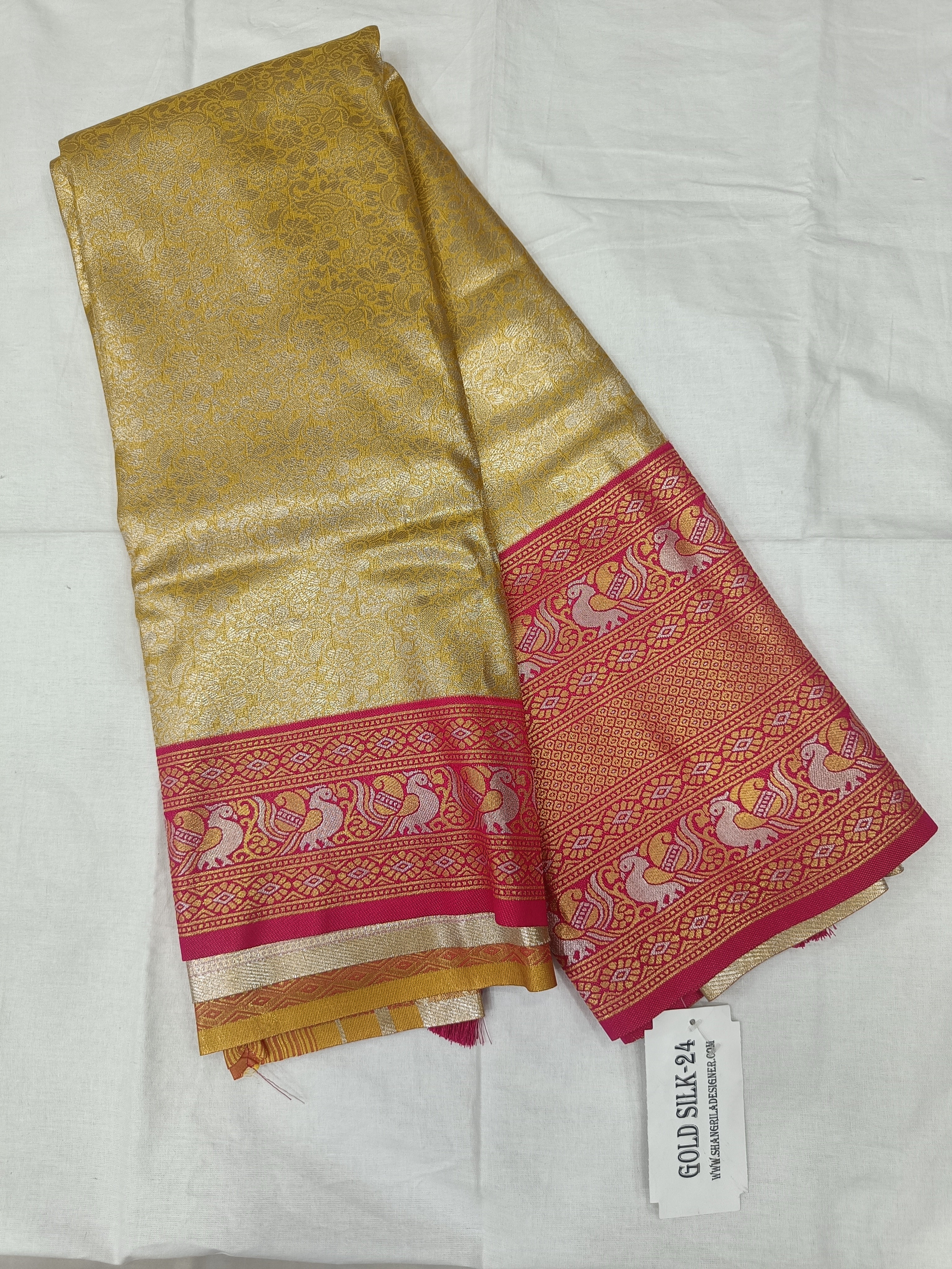 Gold Banarasi silk saree with pink border panel and unstitched blouse fabric