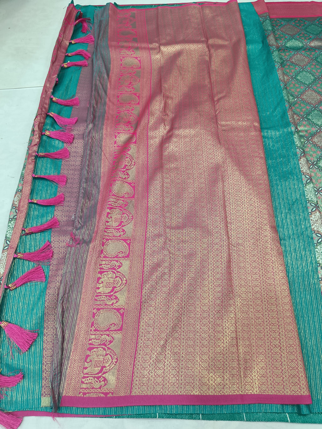 Teal green and pink Banarasi silk saree pallu with tassel fringe and striped trim