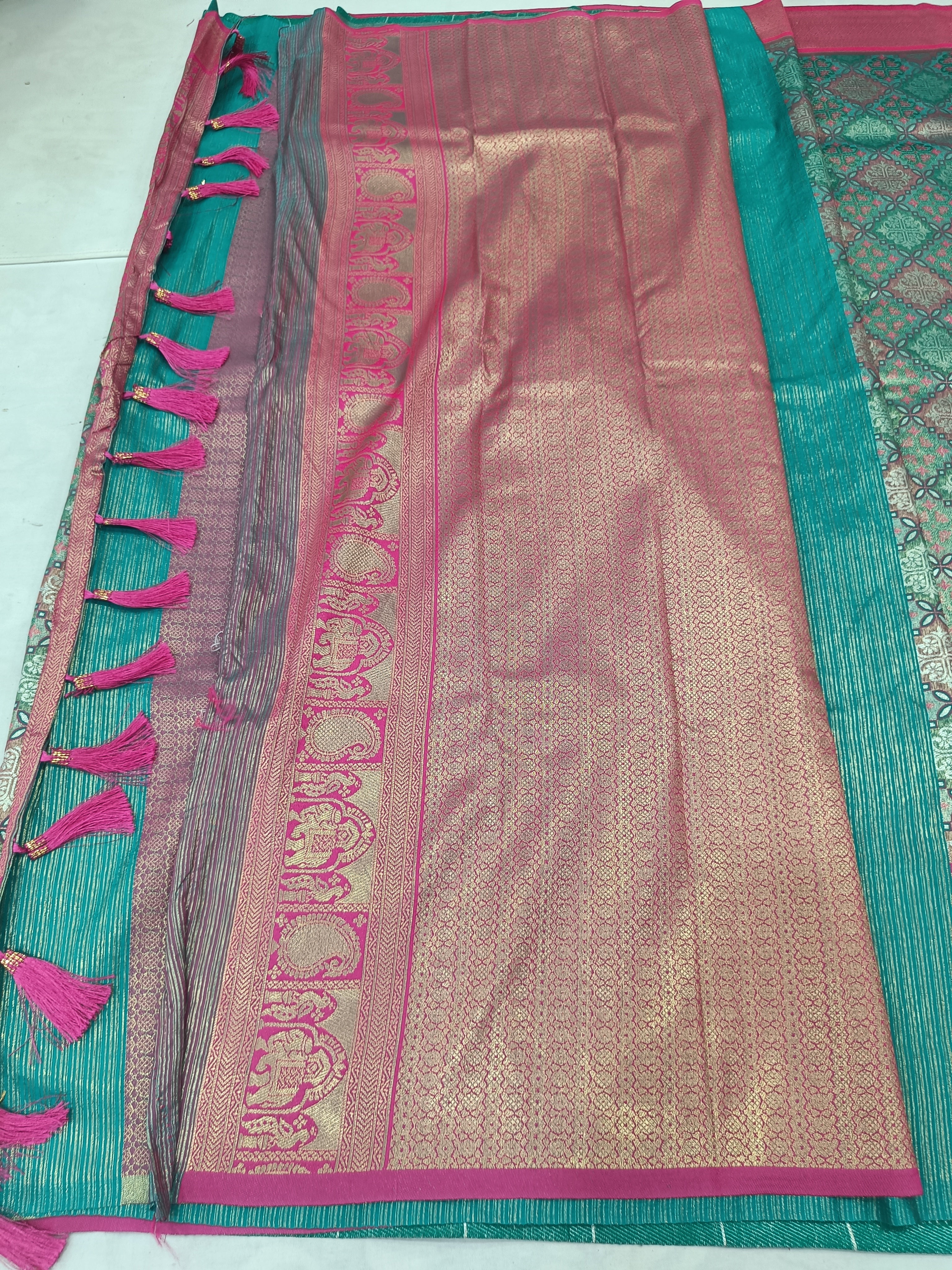 Teal green and pink Banarasi silk saree pallu with tassel fringe and striped trim