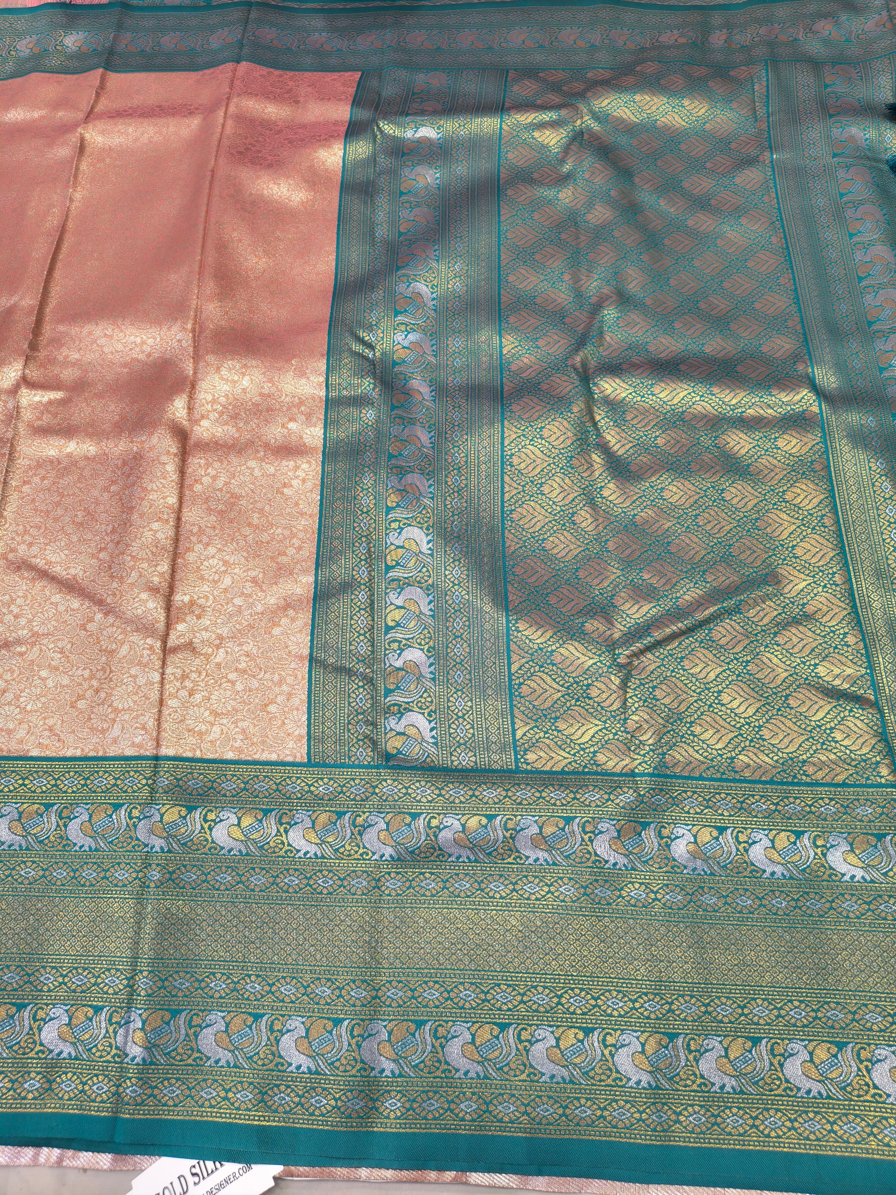 Aqua blue silk border with ornate gold woven medallions on peach saree panel