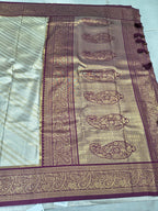 Banarasi silk saree pallu with maroon border and paisley-like gold motifs