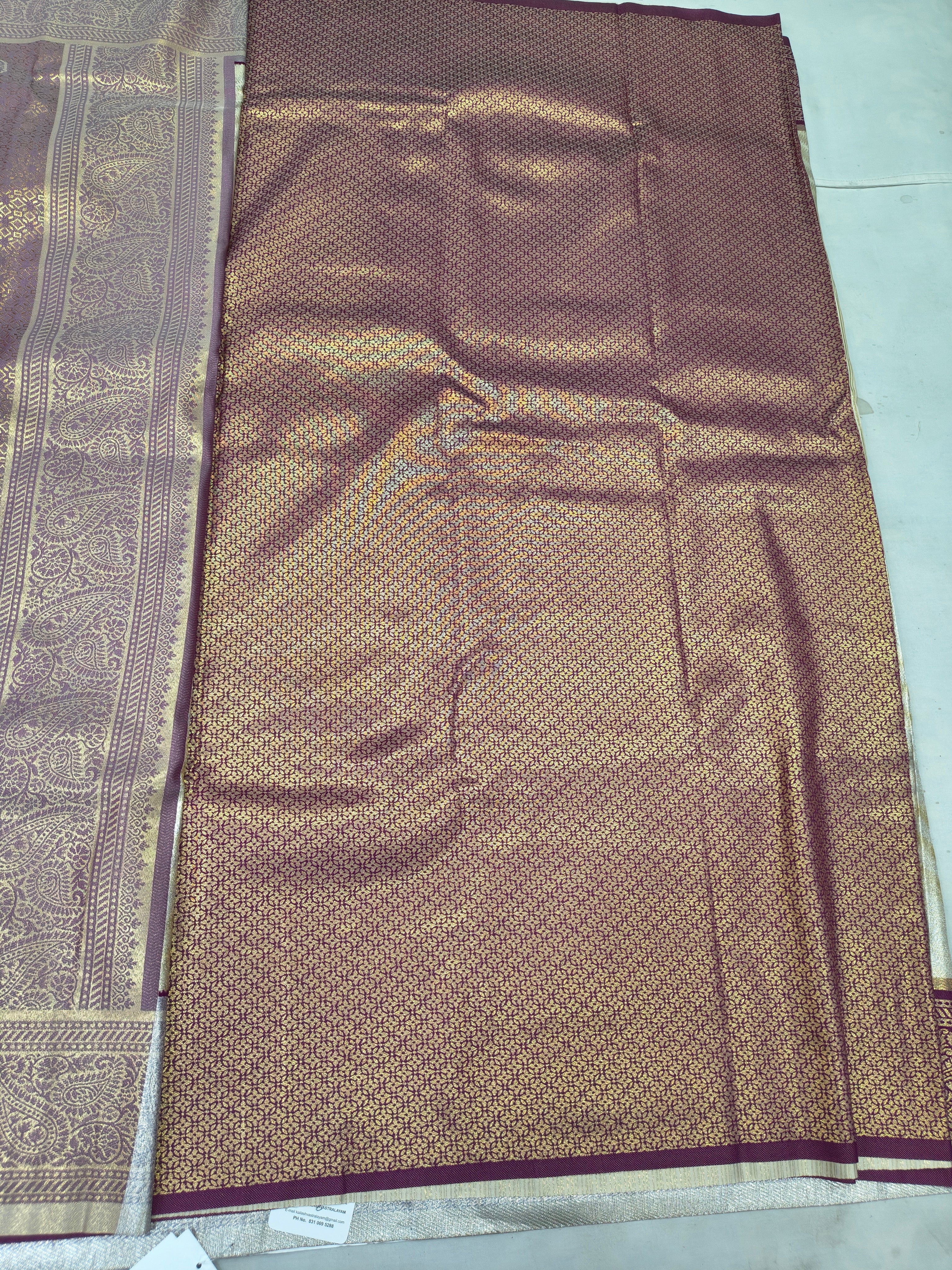 Cream and maroon Banarasi silk saree body with textured gold pattern